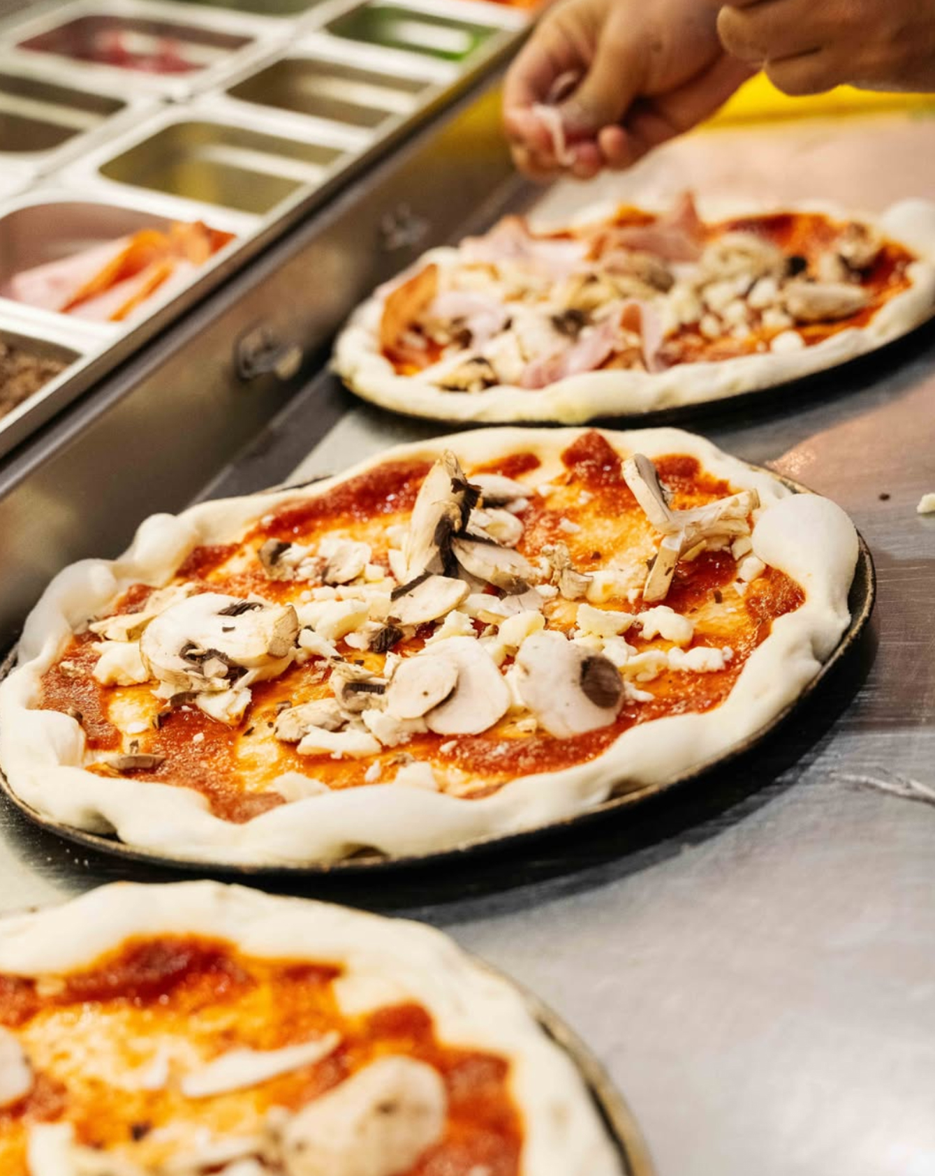 Wood-fired pizza being made at Mad Over Italian Gold Coast