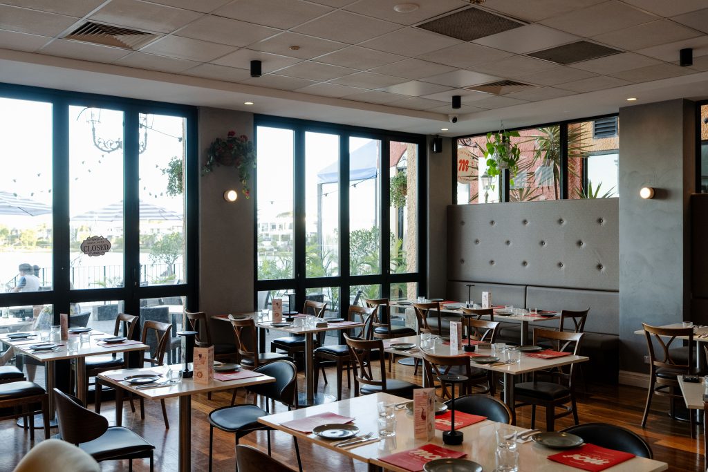 Dining room with water views at Mad Over Italian