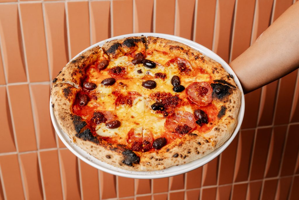 Wood-fired pizza at Mad Over Italian