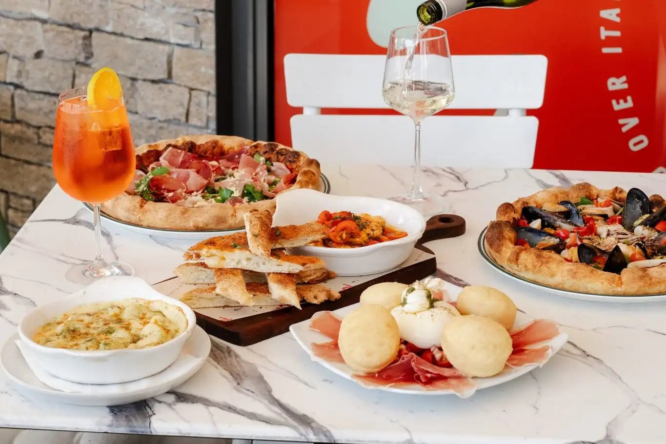 Pizza, pasta and spritz on the terrace at Mad Over Italian